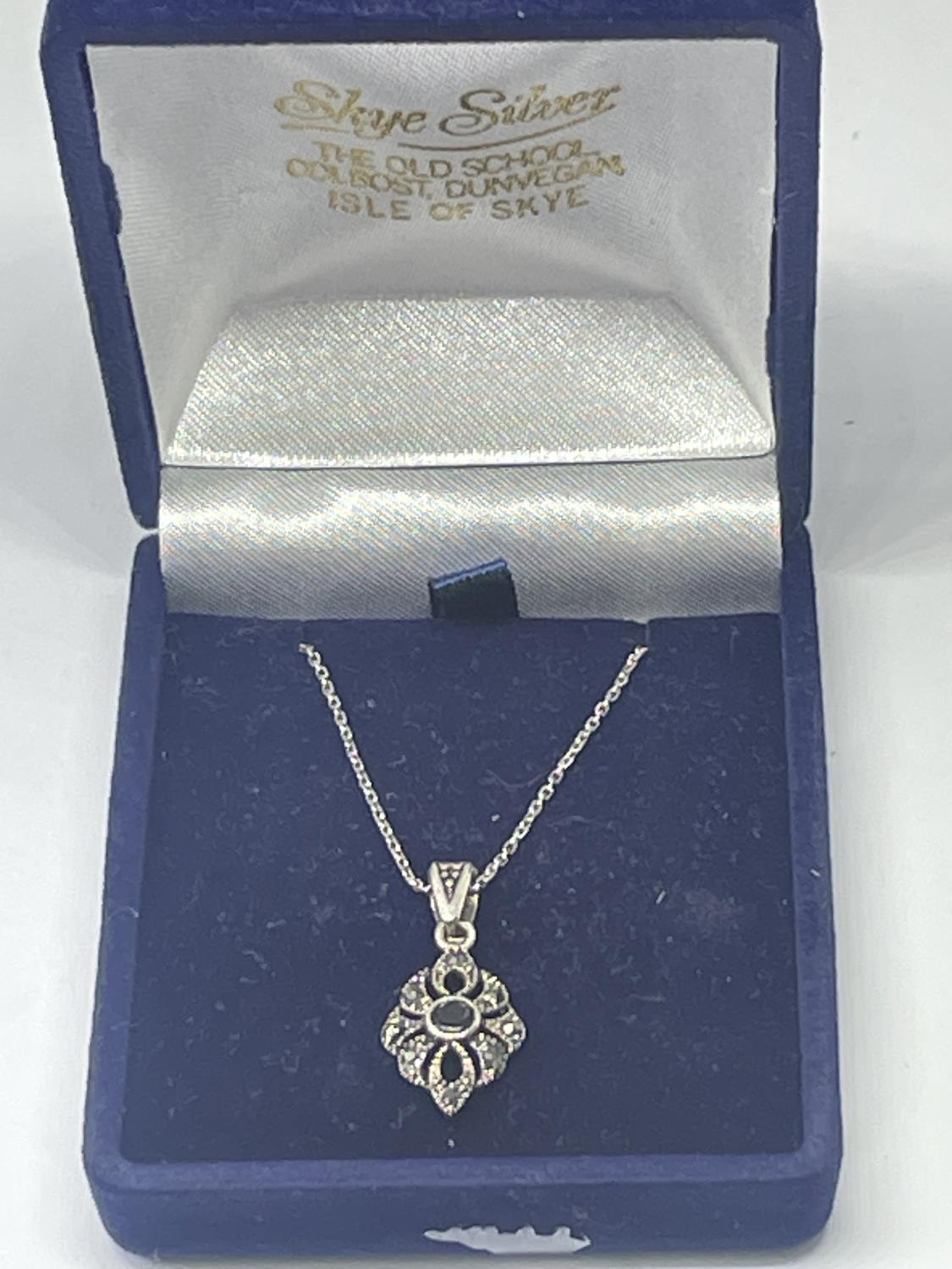 A SILVER NECKLACE WITH MARCASITE PENDANT IN A PRESENTATION BOX