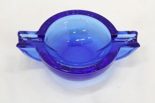 A WW2, CHUNKY BLUE GLASS ASHTRAY, EMBOSSED WITH THE WORDS, 'NEVER WAS SO MUCH, OWED BY SO MANY, TO