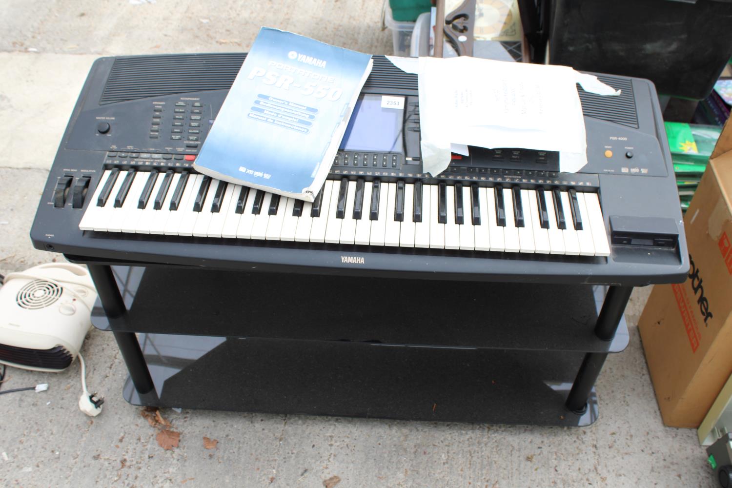 A YAMAHA PRS-4000 KEYBOARD WITH MANUAL AND FLOPPY DISCS