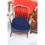 AN ERCOL STYLE FIRESIDE CHAIR WITH SPINDLE BACK