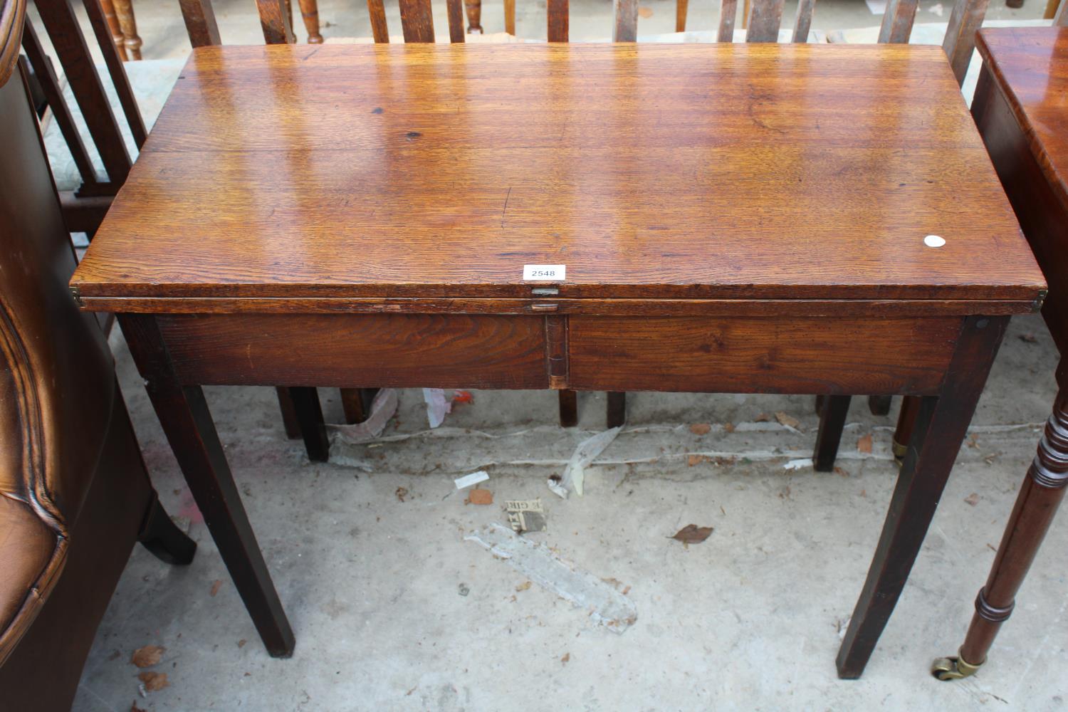 A LATE 19TH CENTURY OAK FOLD-OVER TEA TABLE, 36" WIDE