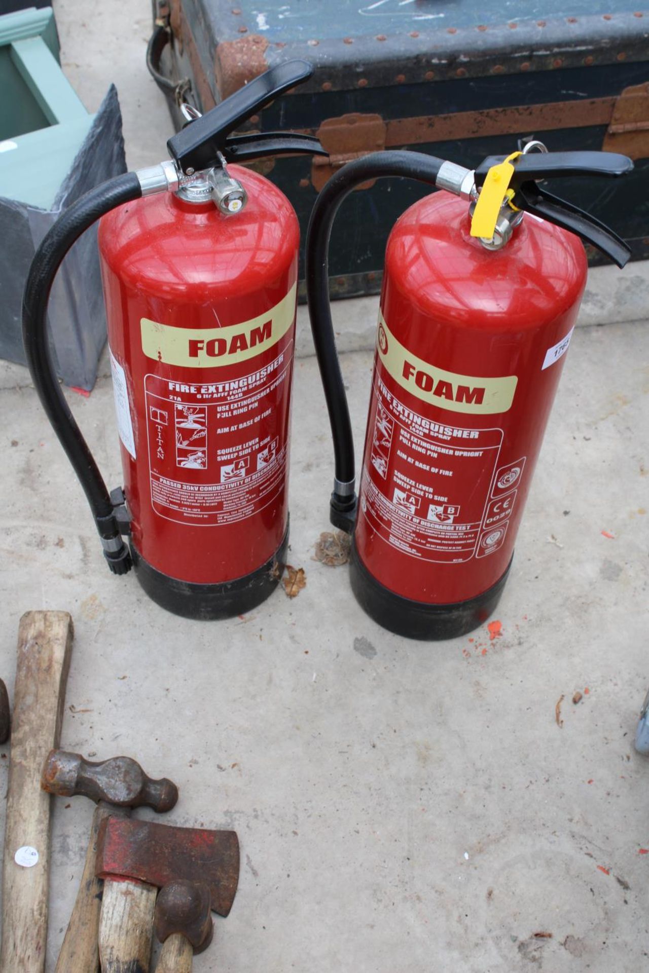 TWO FIRE EXTINGUISHERS