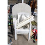 A WHITE PLASTIC GARDEN TABLE AND FOUR STACKING CHAIRS