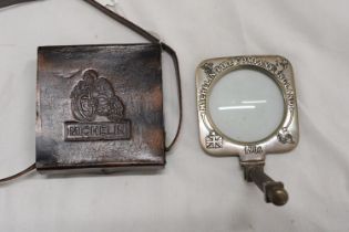 A BRASS MICHELIN MAGNIFYING GLASS IN A LEATHER CASE