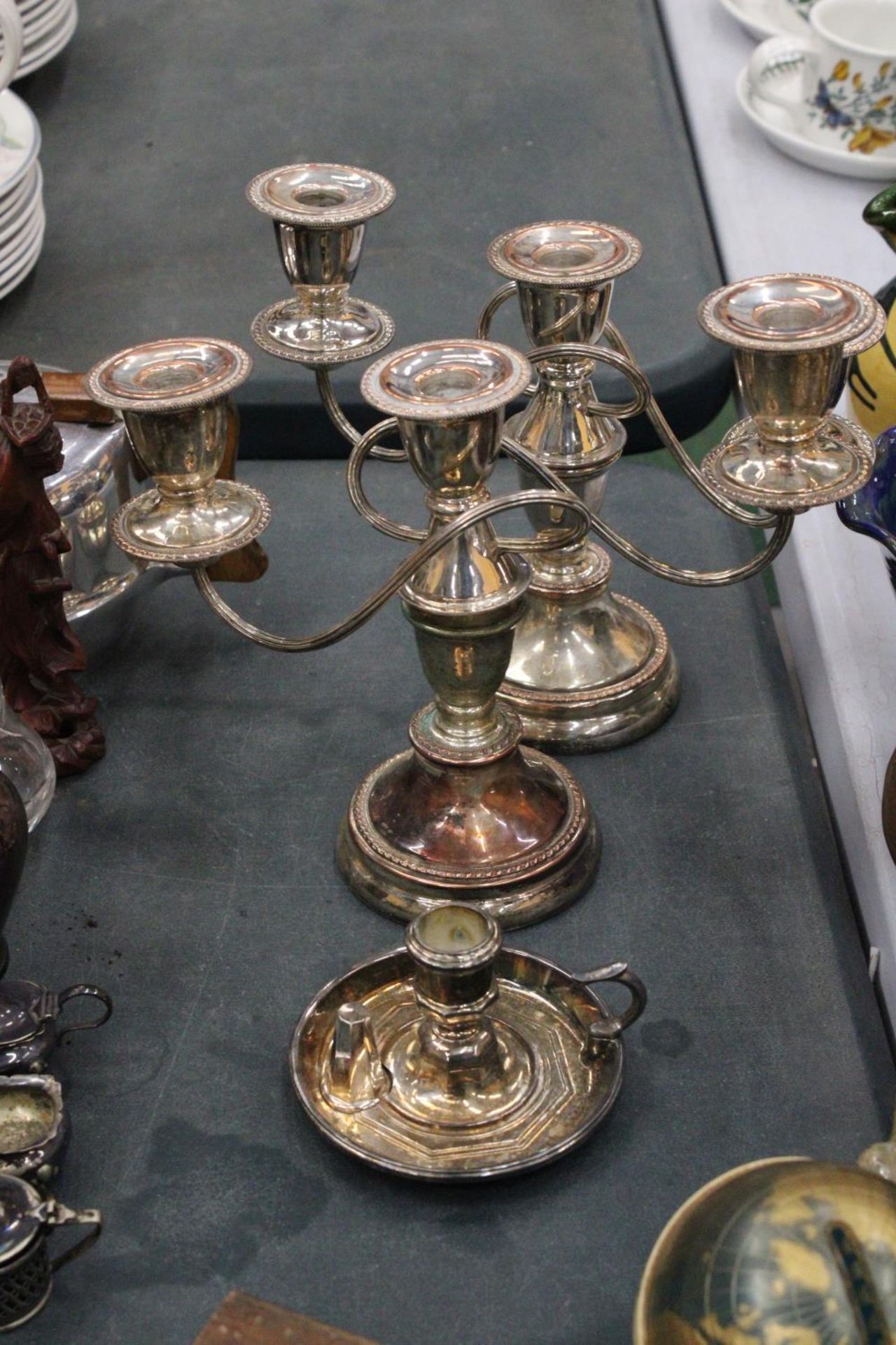 A QUANTITY OF SILVER PLATE TO INCLUDE TWO CANDLEABRAS AND A'WEE WILLIE WINKIE' CANDLESTICK WITH