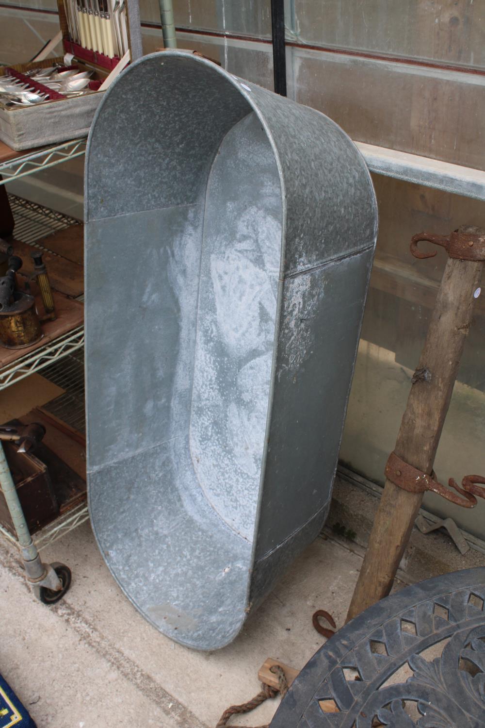 A GALVANISED TIN BATH/PLANTER (L:120CM)