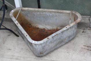 A LARGE GALVANISED CORNER TROUGH PLANTER