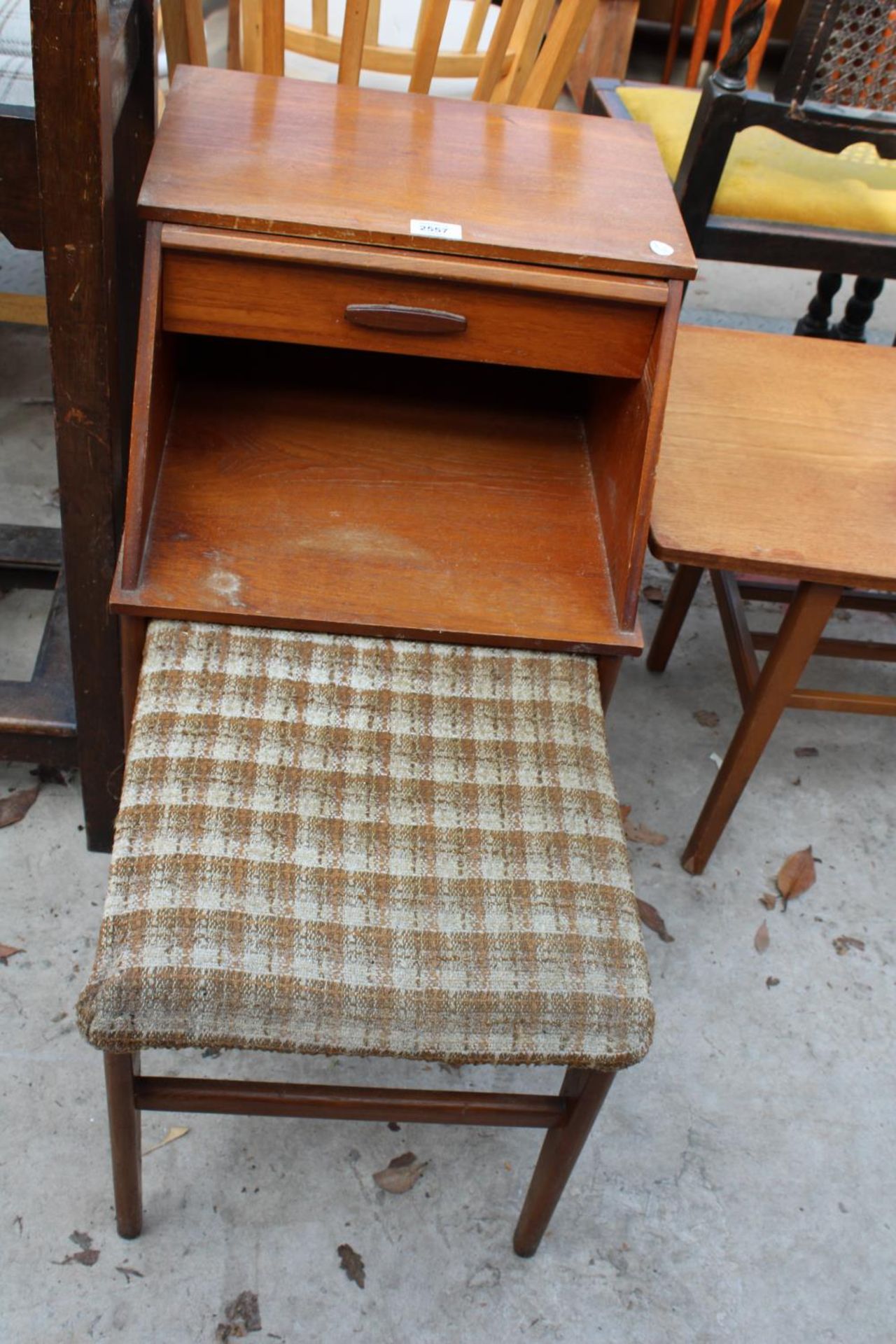 A RETRO TEAK CHIPPY STYLE TELEPHONE TABLE WITH PULL-OUT SEAT, SINGLE DRAWER AND SLIDE