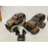 TWO REMOTE CONTROL LANDROVERS WITH BATTERIES, CHARGERS AND ONE REMOTE CONTROL, IN WORKING ORDER