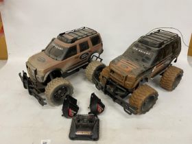 TWO REMOTE CONTROL LANDROVERS WITH BATTERIES, CHARGERS AND ONE REMOTE CONTROL, IN WORKING ORDER
