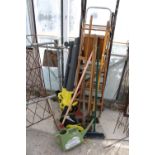 AN ASSORTMENT OF GARDEN TOOLS TO INCLUDE RAKES, LADDERS AND AN ELECTRIC LEAF BLOWER