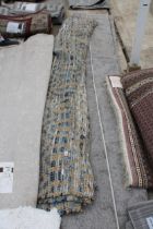 A BELIEVED AS NEW MADE IN TURKEY NAVY AND NATURAL RUG (275CM x 365CM)