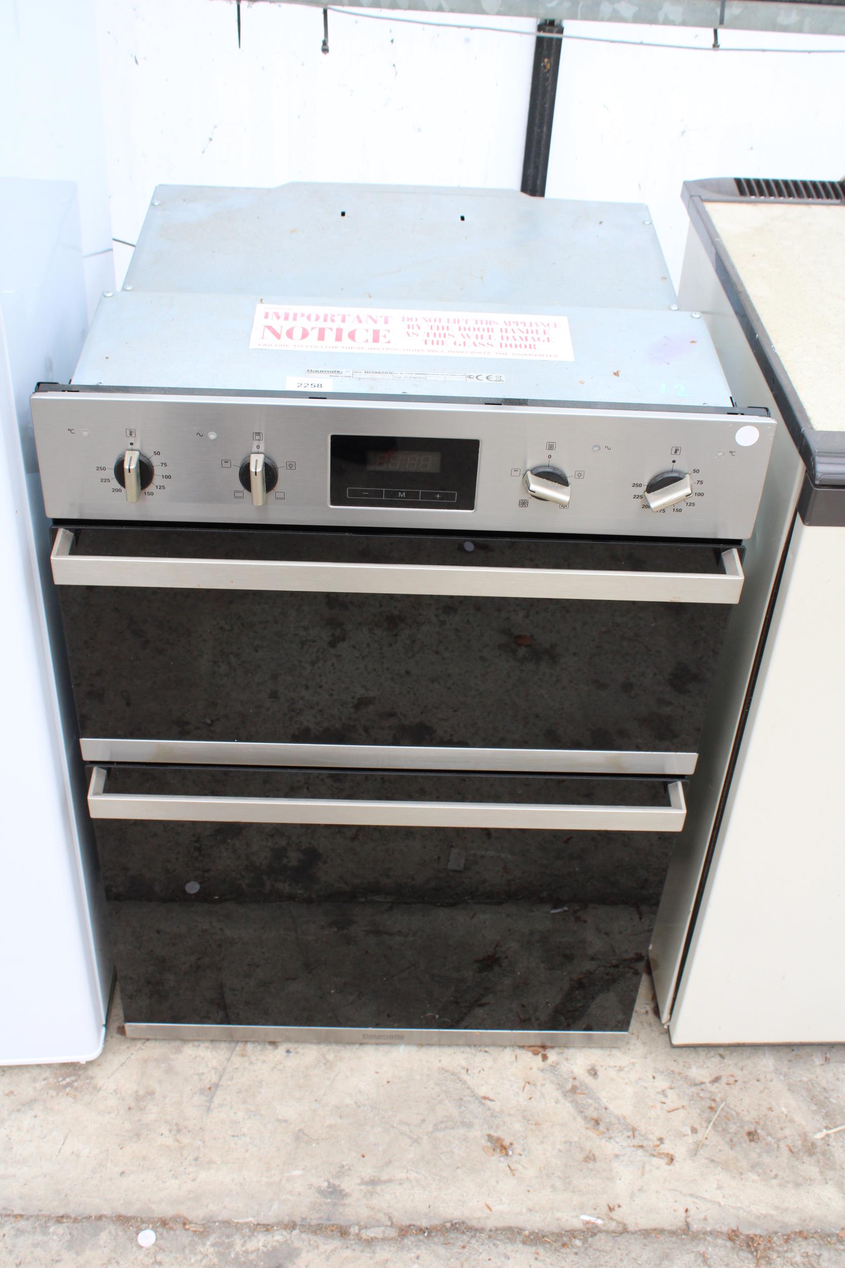 A CHROME AND BLACK BAUMATIC INTERGRATED DOUBLE OVEN