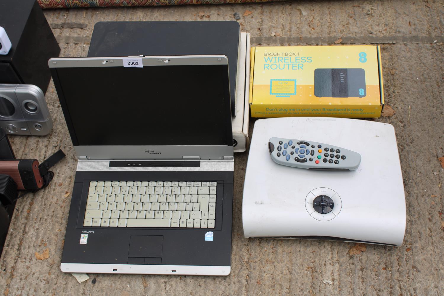 AN ASSORTMENT OF ITEMS TO INCLUDE A FUJITSU LAPTOP AND A SKY BOX ETC