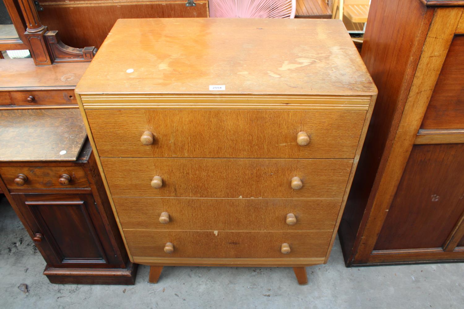 A MID 20TH CENTURY LIGHT OAK CHEST OF FOUR DRAWERS BEARING B.S.STANDARD KITE MARK, 30" WIDE