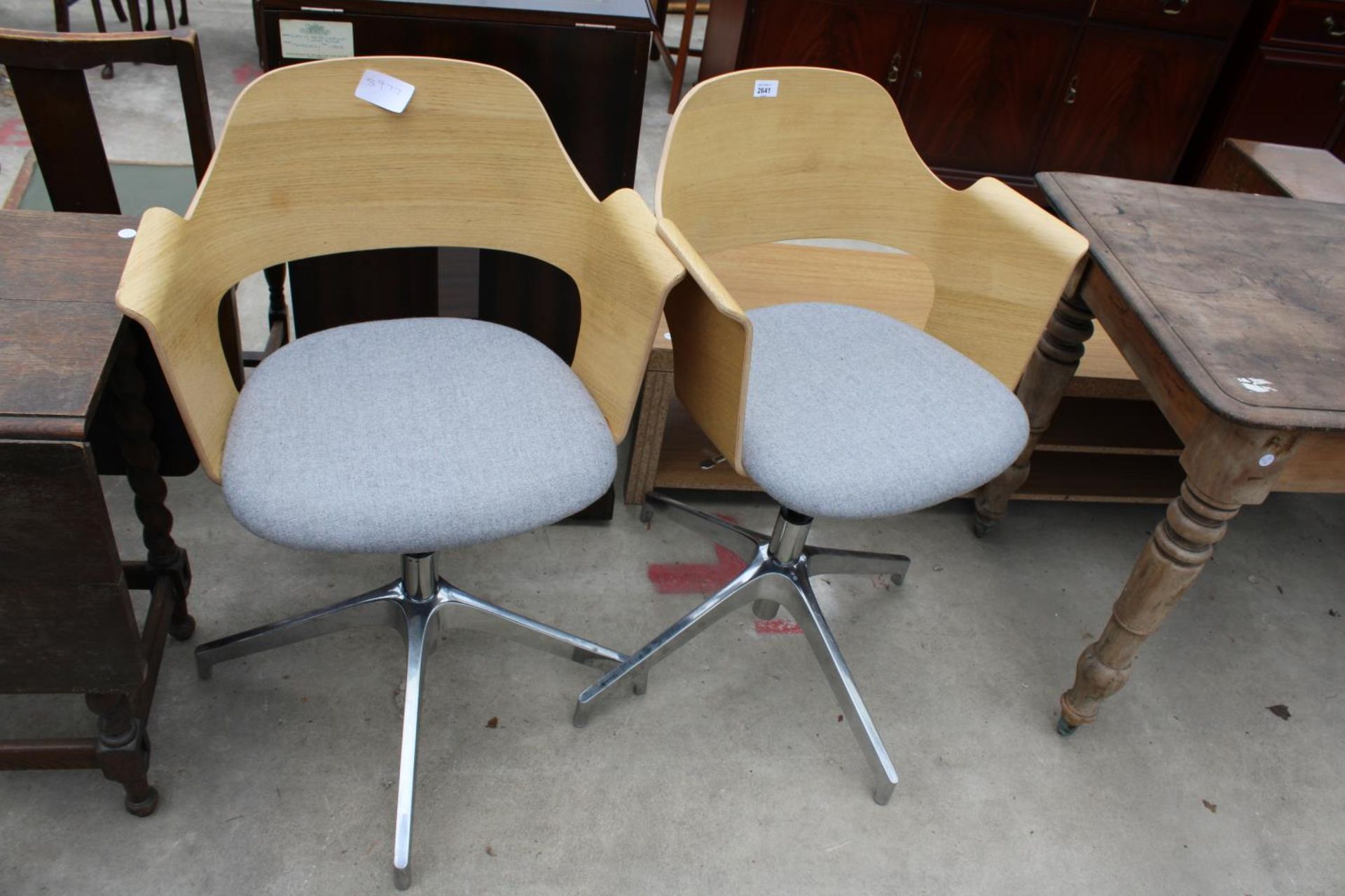 A PAIR OF BENTWOOD CONFERENCE CHAIRS ON SWIVEL BASES