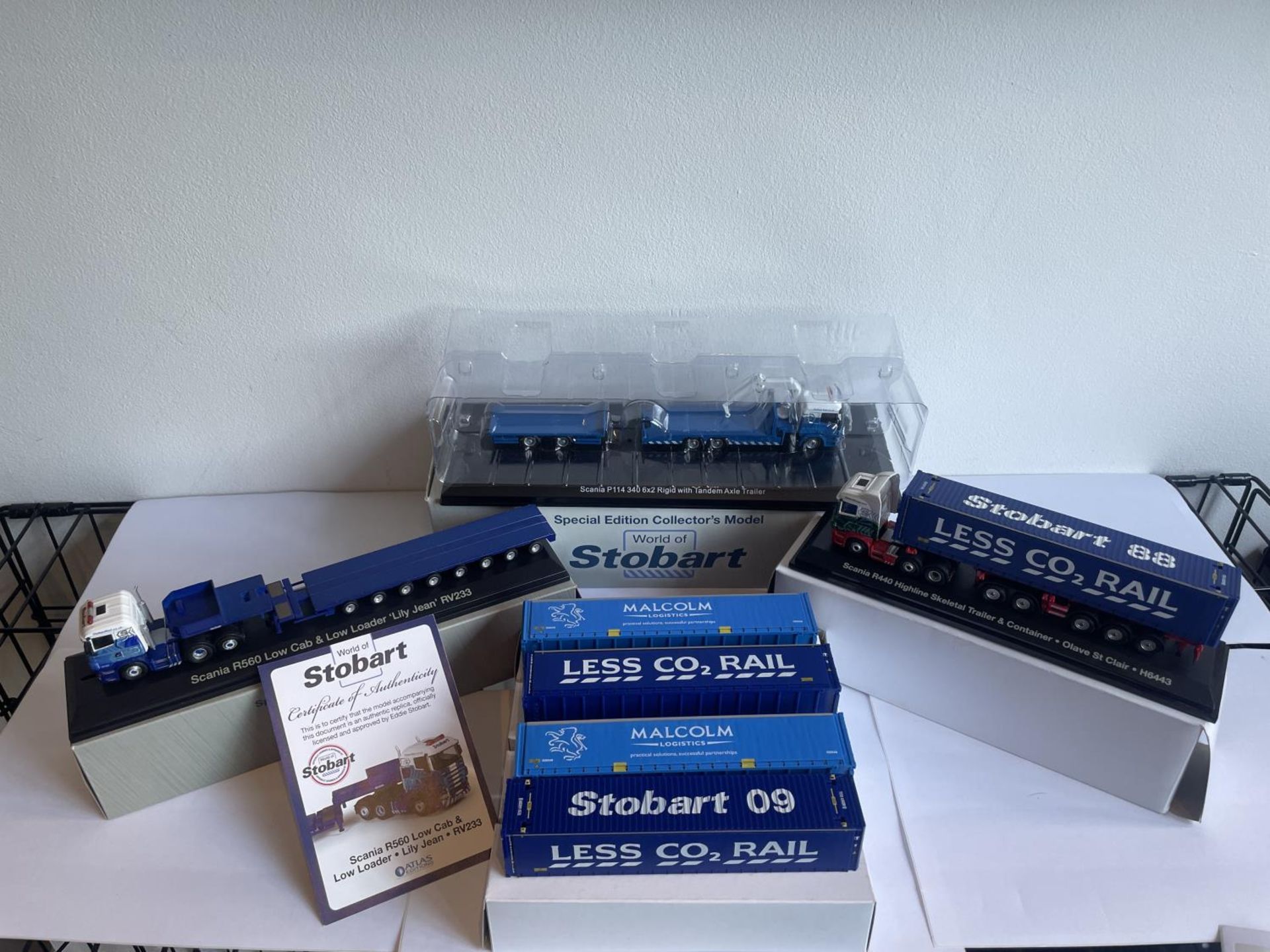 THREE BOXED STOBART WAGONS (ONE WITH COA) AND FOUR CONTAINERS