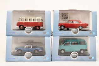 FOUR VARIOUS AS NEW AND BOXED OXFORD AUTOMOBILE COMPANY VEHICLES