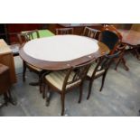 A REGENCY STYLE PEDESTAL DINING TABLE AND FIVE CHAIRS