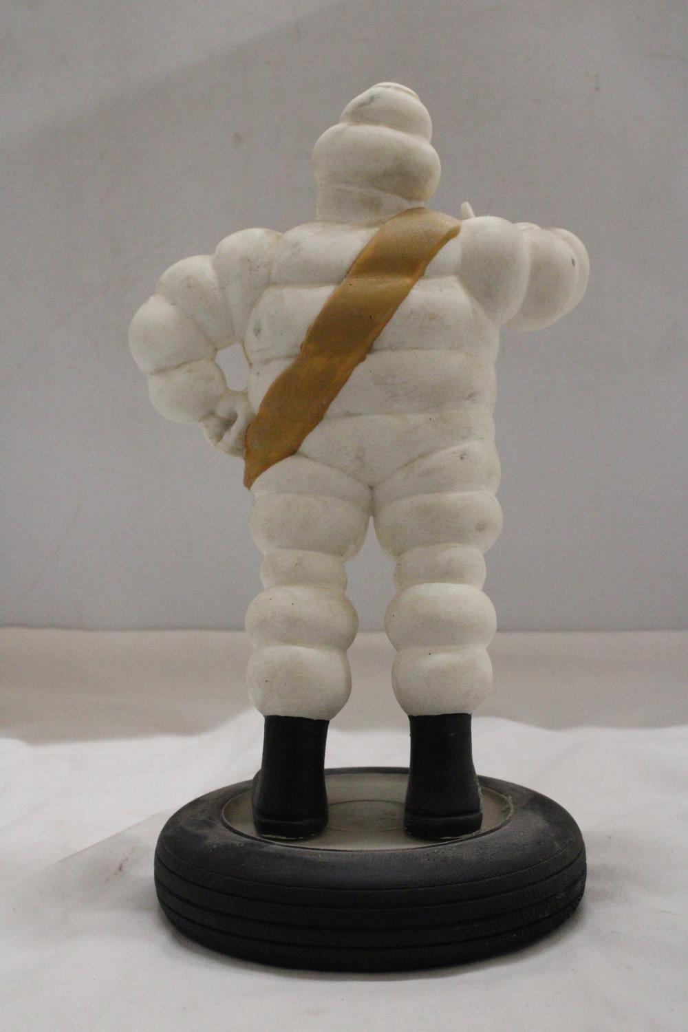 A VINTAGE ORIGINAL MICHELIN MAN ON TYRE APPROXIMATELY 33 CM HIGH - Image 4 of 5