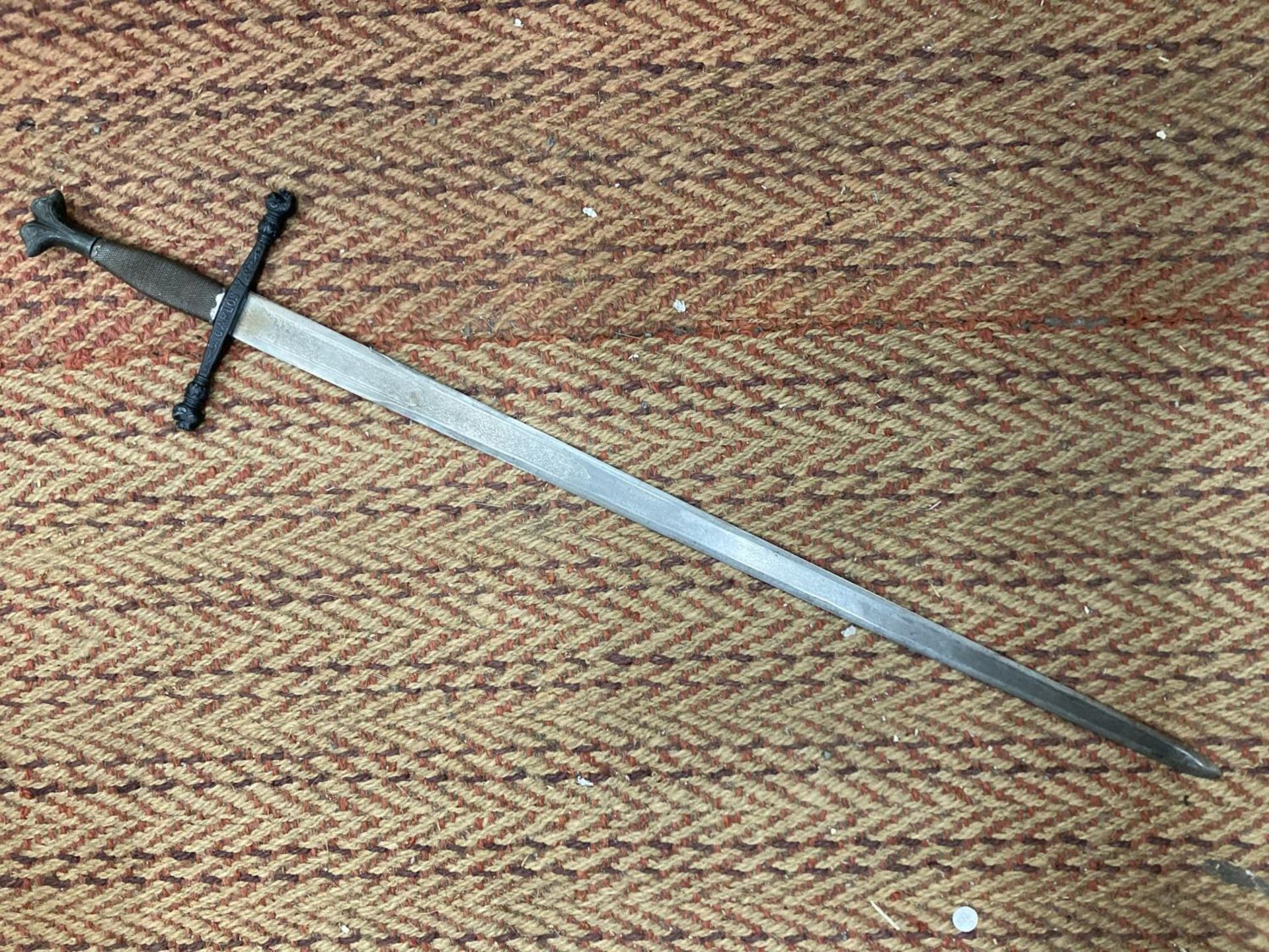 A KING CARLOS V HEAVY LONG SWORD WITH ORNATE BLADE OF TOLEDO STEEL - APPROXIMATELY 104CM