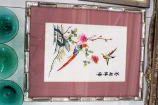 AN ORIENTAL SILK HAND EMBROIDERED ART PIECE IN BAMBOO FRAME