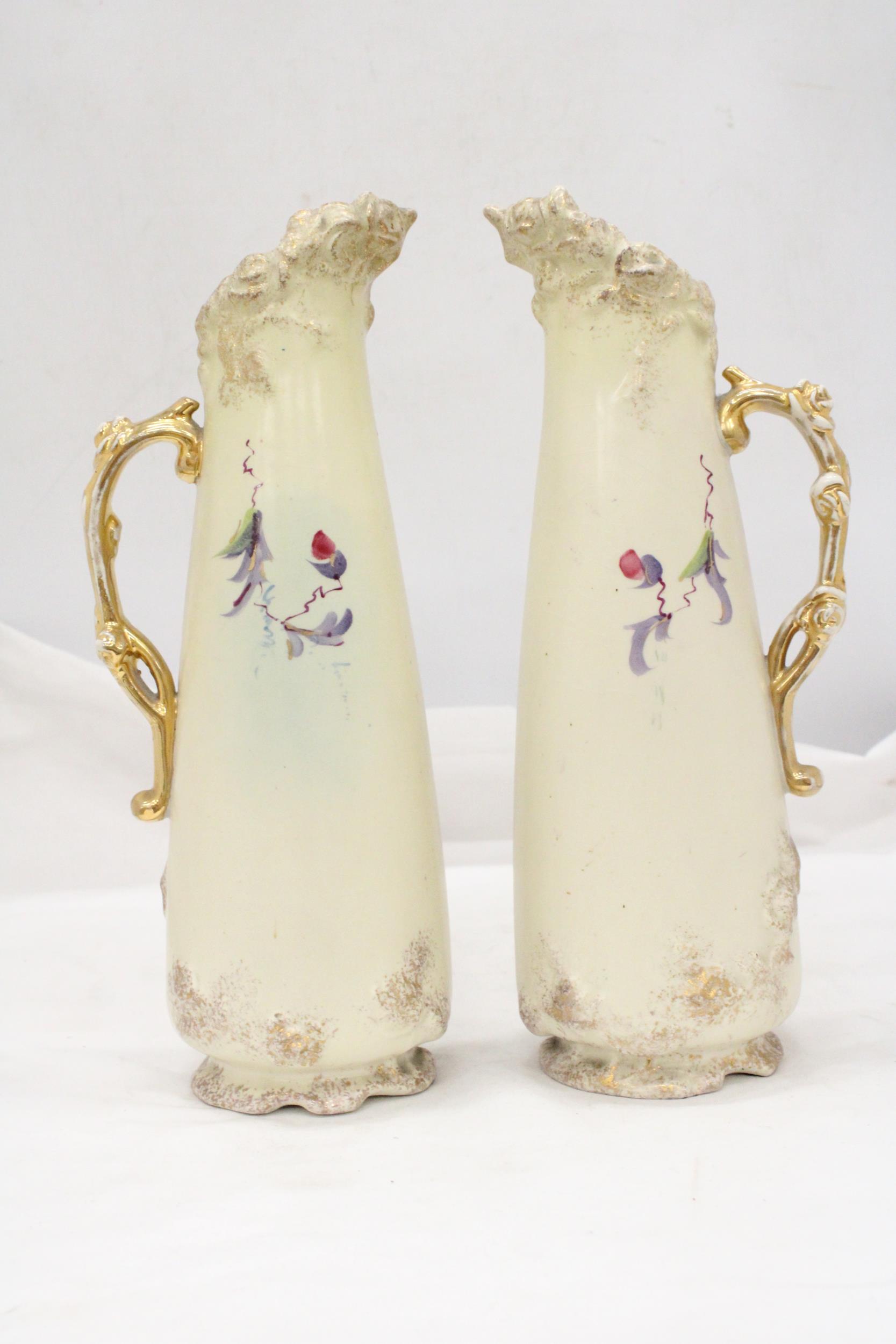A PAIR OF VICTORIAN JUGS IN IVORY WITH FLORAL AND GILT DECORATION - APPROXIMATELY 31CM HIGH - Image 3 of 5