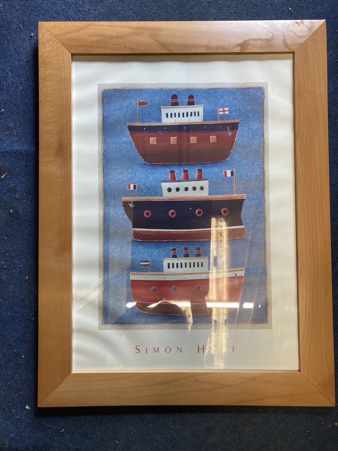 A SIMON HART PRINT OF THREE BOATS IN A PINE FRAME, 63CM X 82CM