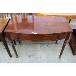 A 19TH CENTURY MAHOGANY BOW-FRONTED SIDE-TABLE WITH SINGLE DRAWER ON TURNED LEGS, 39.5" WIDE