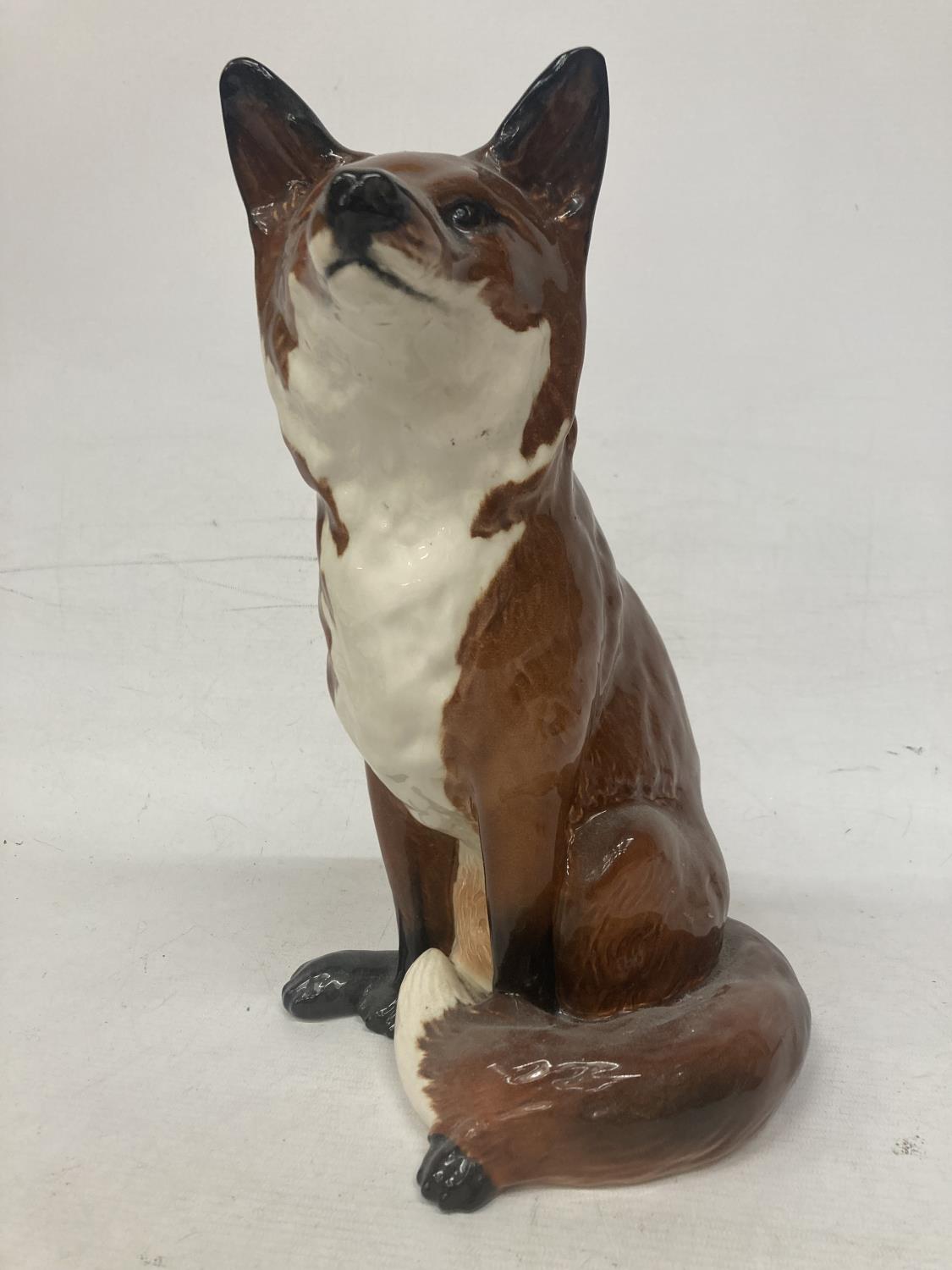 A LARGE MODEL OF A BESWICK FIRESIDE FOX