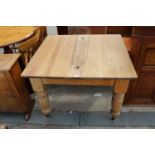 A VICTORIAN PINE KITCHEN TABLE ON TURNED LEGS, 39" X 37"