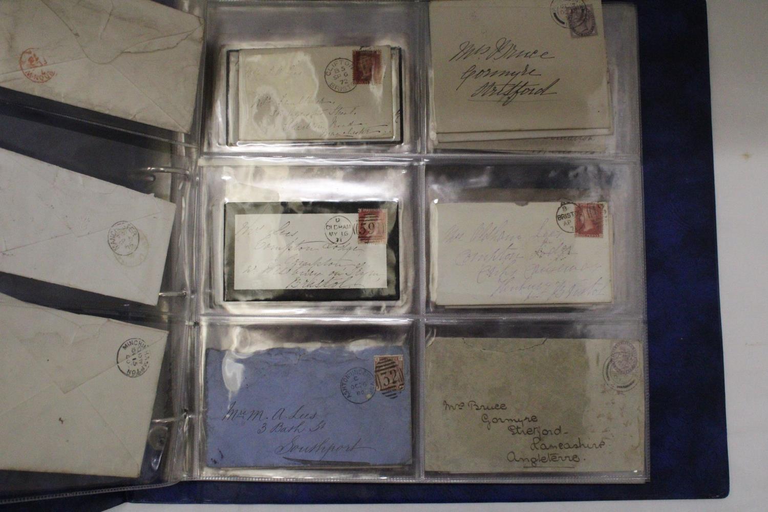 A SELECTION OF VICTORIAN ENVELOPES IN A BLUE BINDER WITH FIFTY PENNY RED STAMPS - Image 3 of 6