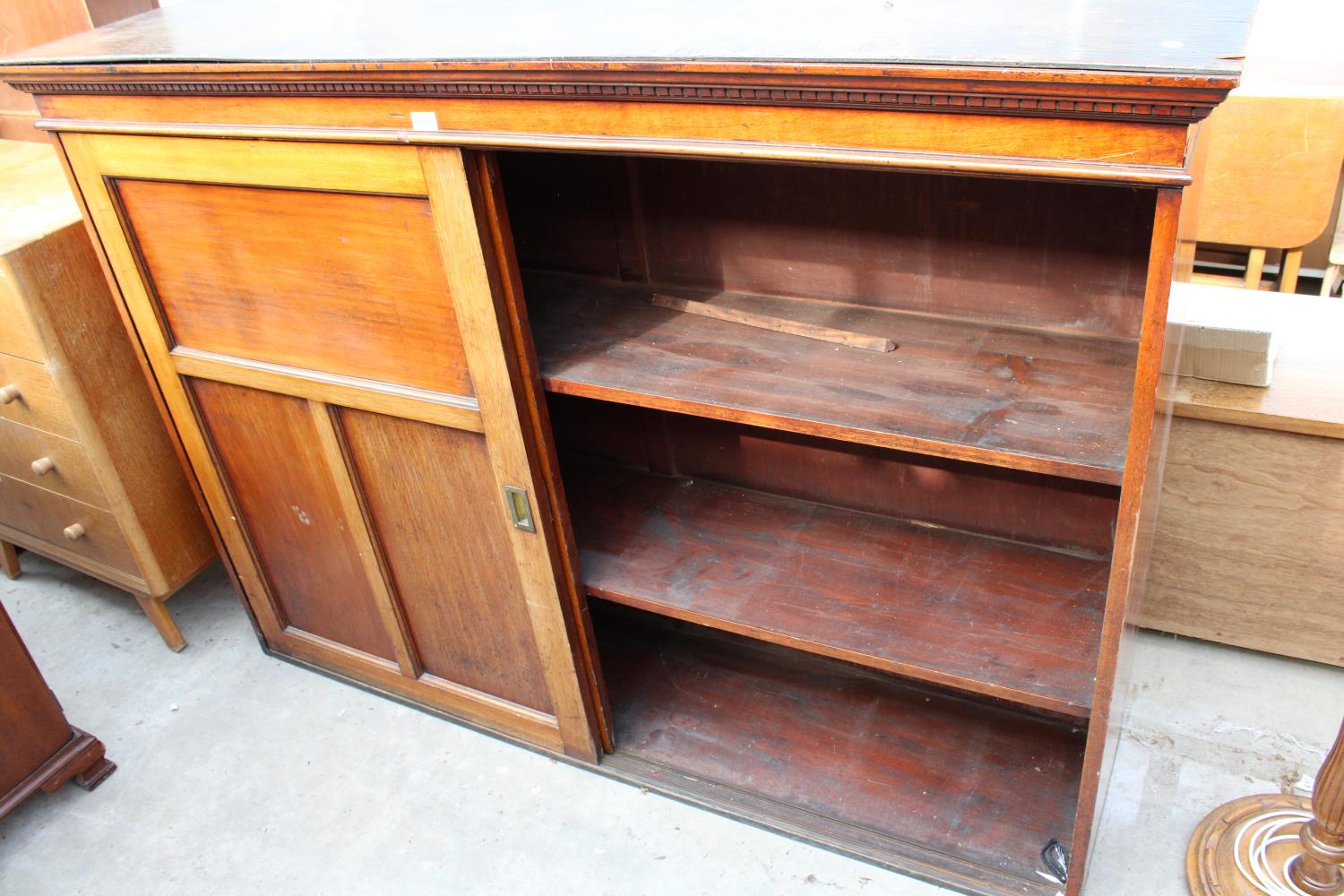 A VICTORIAN MAHOGANY STORAGE CABINET WITH TWO SLIDING DOORS HAVING SUNKEN BRASS HANDLES, 68" WIDE - Image 3 of 3