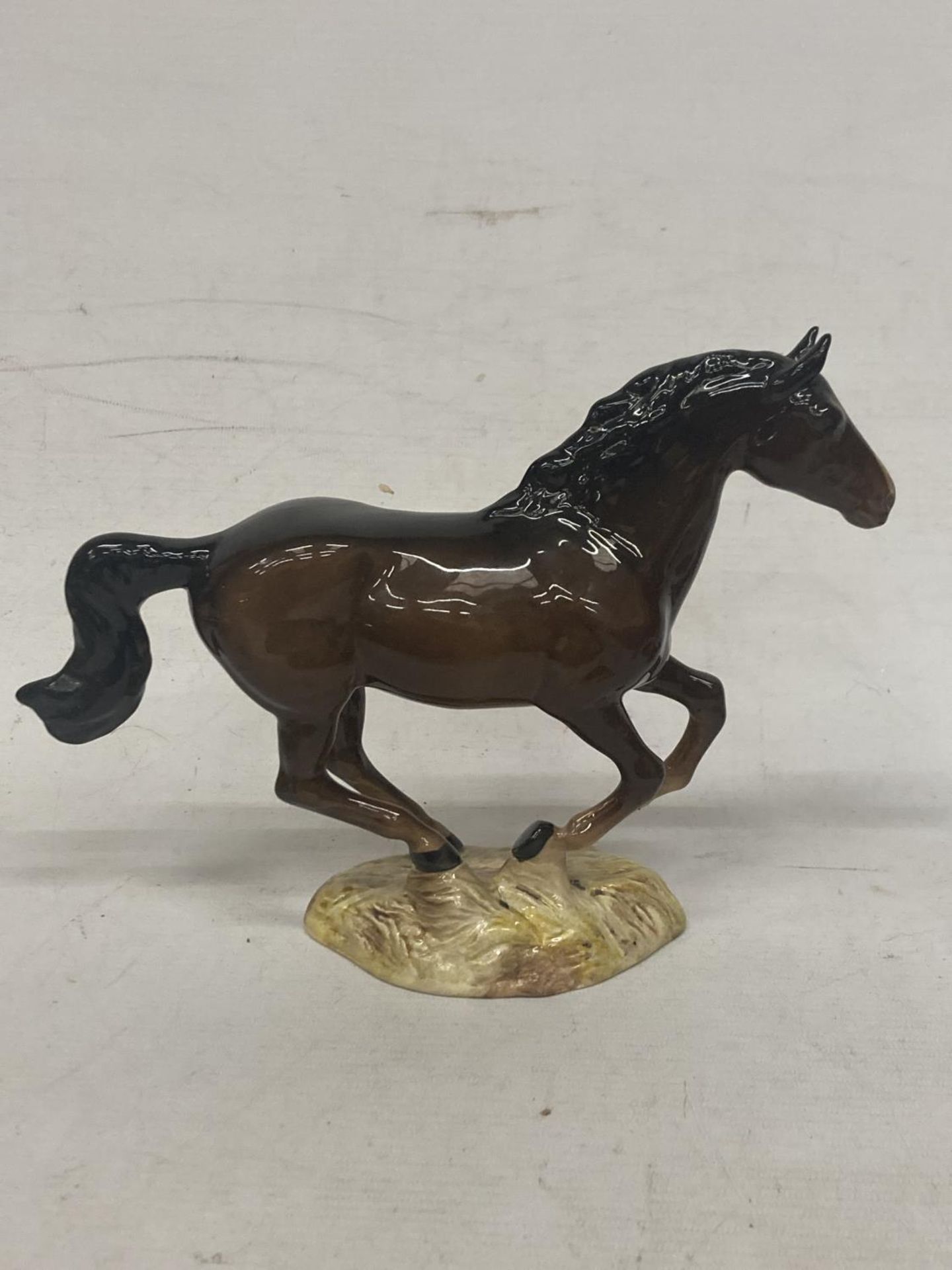 A RARE BESWICK GALLOPING BROWN HORSE BAY HORSE MODEL NO. 1374