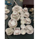 A QUANTITY OF ROYAL ALBERT 'LAVENDER ROSE' CHINA TO INCLUDE, VARIOUS SIZES OF PLATES, A CREAM JUG,