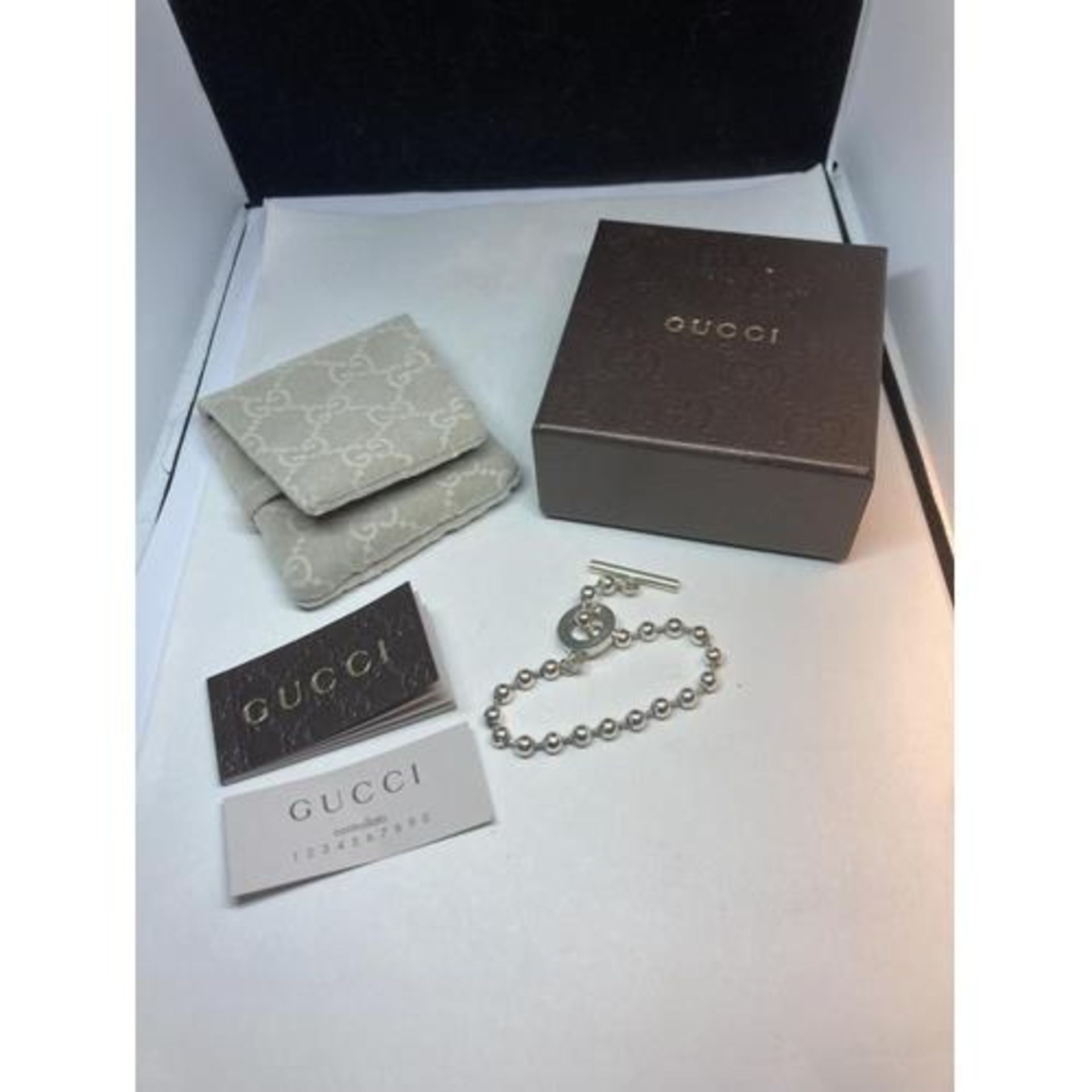 A GENUINE GUCCI SILVER BOULE CHAIN BRACELET APPROXIMATLY 18CM LONG IN ORIGINAL PRESENTATION BOX WITH