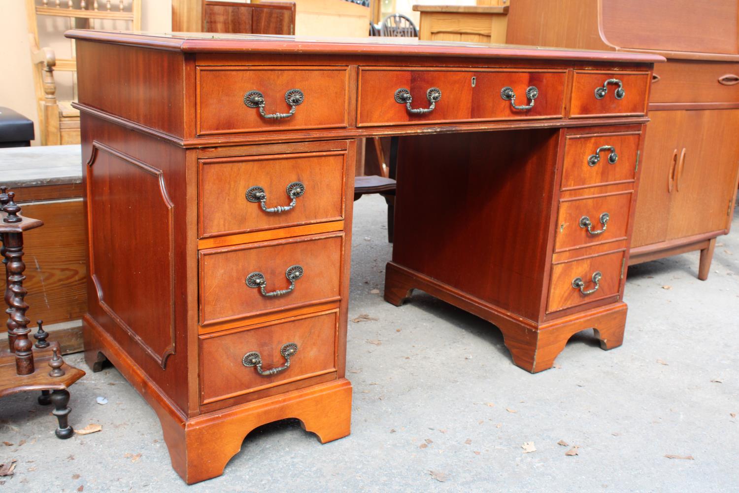 A MAHOGANY TWIN-PEDESTAL DESK ENCLOSING SIX DRAWERS AND ONE CUPBOARD WITH INSET LEATHER TOP, 48" X - Image 2 of 5