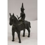 AN ORIENTAL BRONZE HORSE AND WARRIOR RIDER, HEIGHT 25CM, LENGTH 23CM