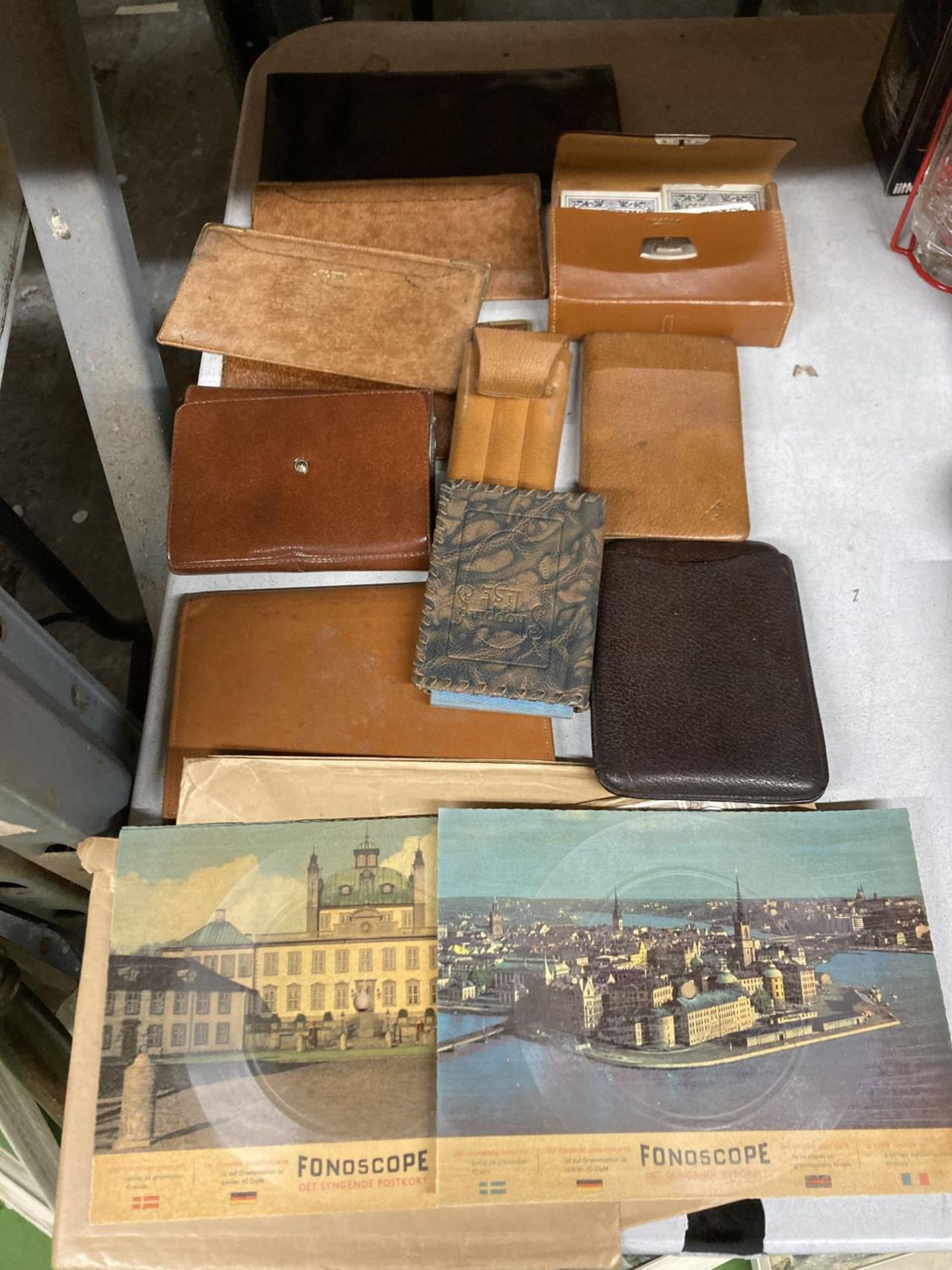 A QUANTITY OF VINTAGE LEATHER WALLETS, CASED PLAYING CARDS, 'FONDOSCOPES', ETC