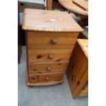 A MODERN PINE FOUR DRAWER BEDSIDE CHEST