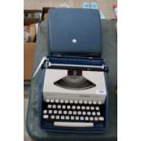 A REMINGTON ENVOY III TYPEWRITER WITH CARRY CASE