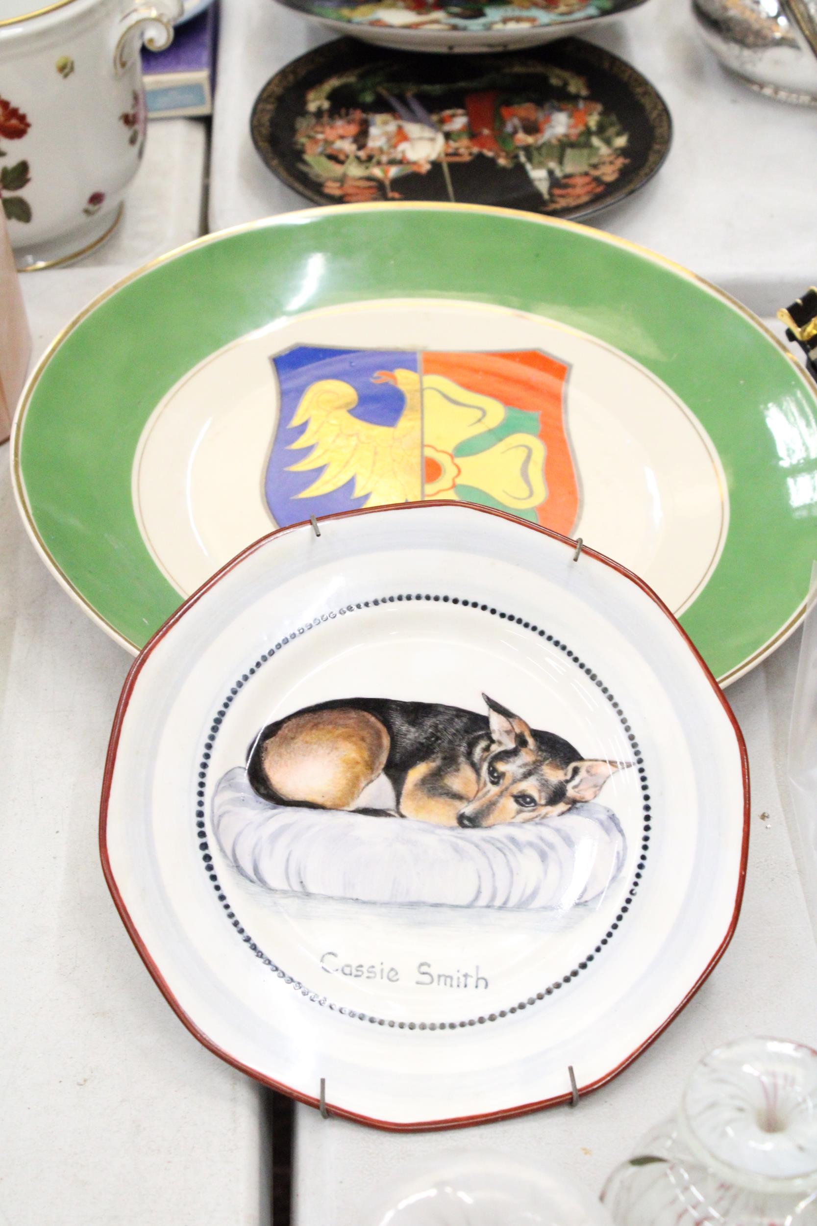 A TULOWICE P. T. POLAND PLATE AND A SIGNED DOG PLATE