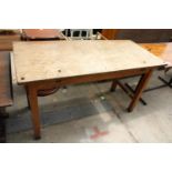 a high work table with single piece top on square legs, 60" x 27"