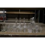 A LARGE QUANTITY OF GLASSES TO INCLUDE CHAMPAGNE FLUTES, WHISKY GLASSES, TUMBLERS, DESSERT