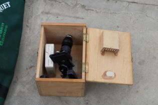 A CASED BRITEX MINOR MICROSCOPE AND GLASS SLIDES