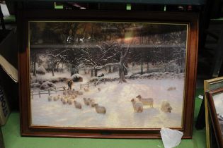 A LARGE FRAMED JOSEPH FARQUHARSON PRINT OF SHEEP IN A SNOWY FIELD, 86CM X 62CM