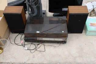 AN HITACHI RECORD PLAYER WITH FM STEREO AND A PAIR OF WOODEN CASED SPEAKERS