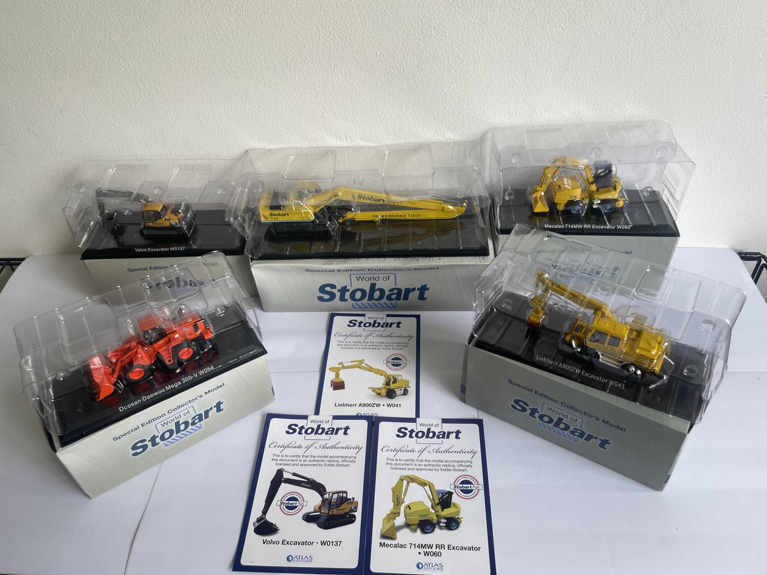 FIVE BOXED STOBART MODELS OF VARIOUS EXCAVATORS SOME THREE WITH COA