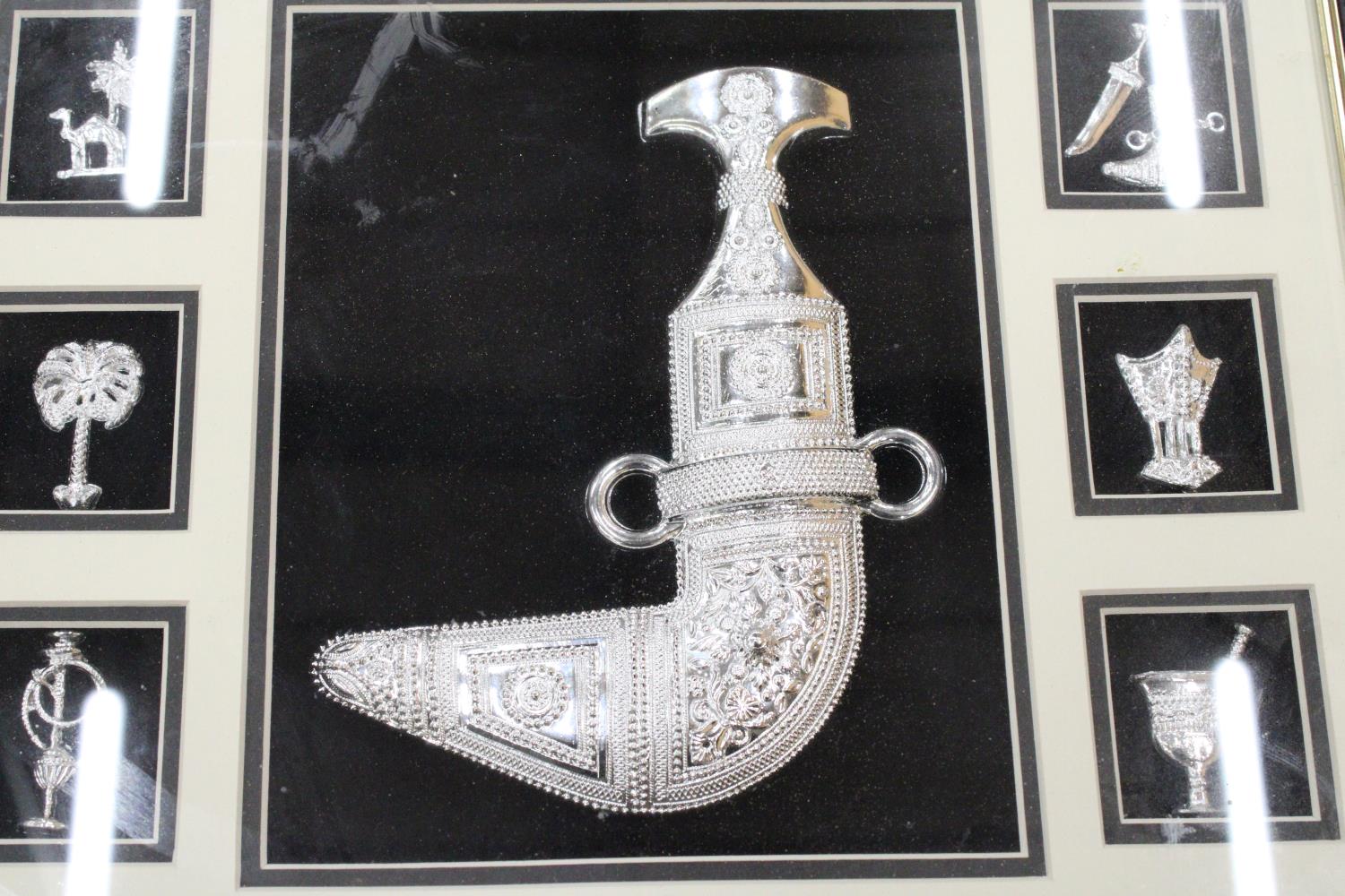 A BOXED AND GLAZED SILVERED ARTEFACTS FROM MUSCAT, OMAN - 17 X 17 INCH - Image 3 of 5