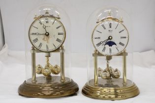 TWO BRASS ANNIVERSARY CLOCKS WITH GLASS DOMES
